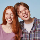 Family Portrait Of Young Cheerful Funny Joyful Couple Play