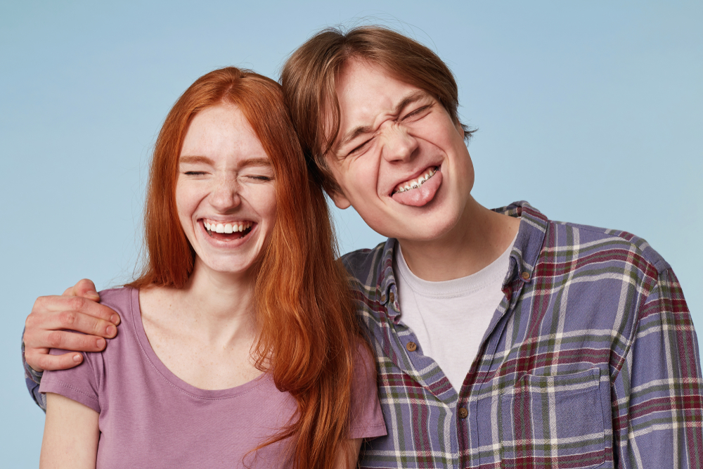 Family Portrait Of Young Cheerful Funny Joyful Couple Play