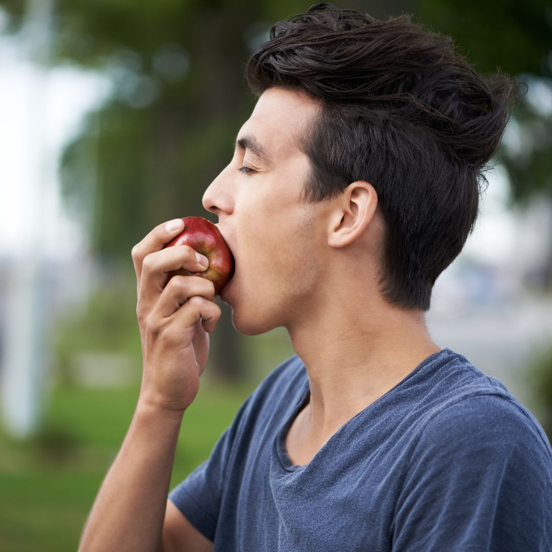 man eating an apple