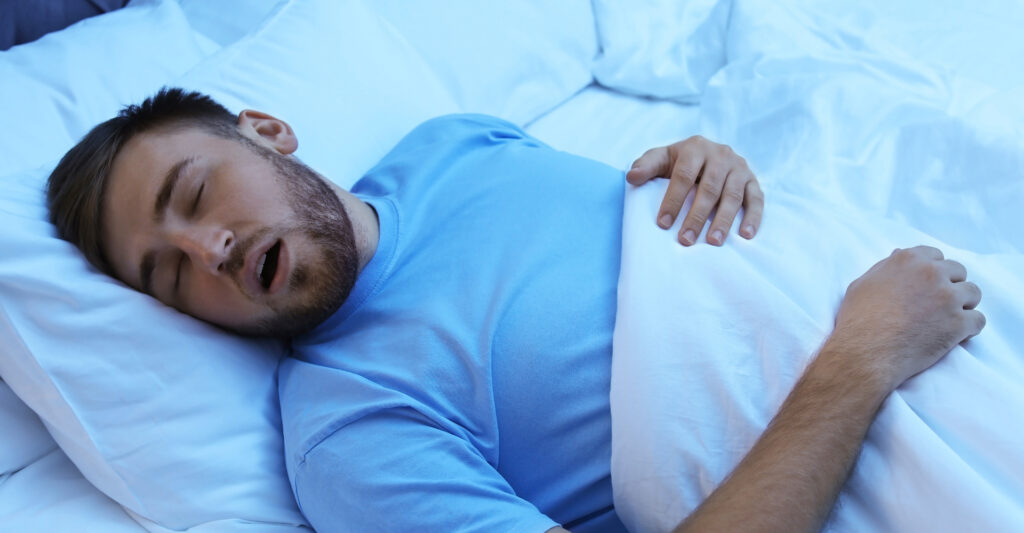 man snoring while sleeping